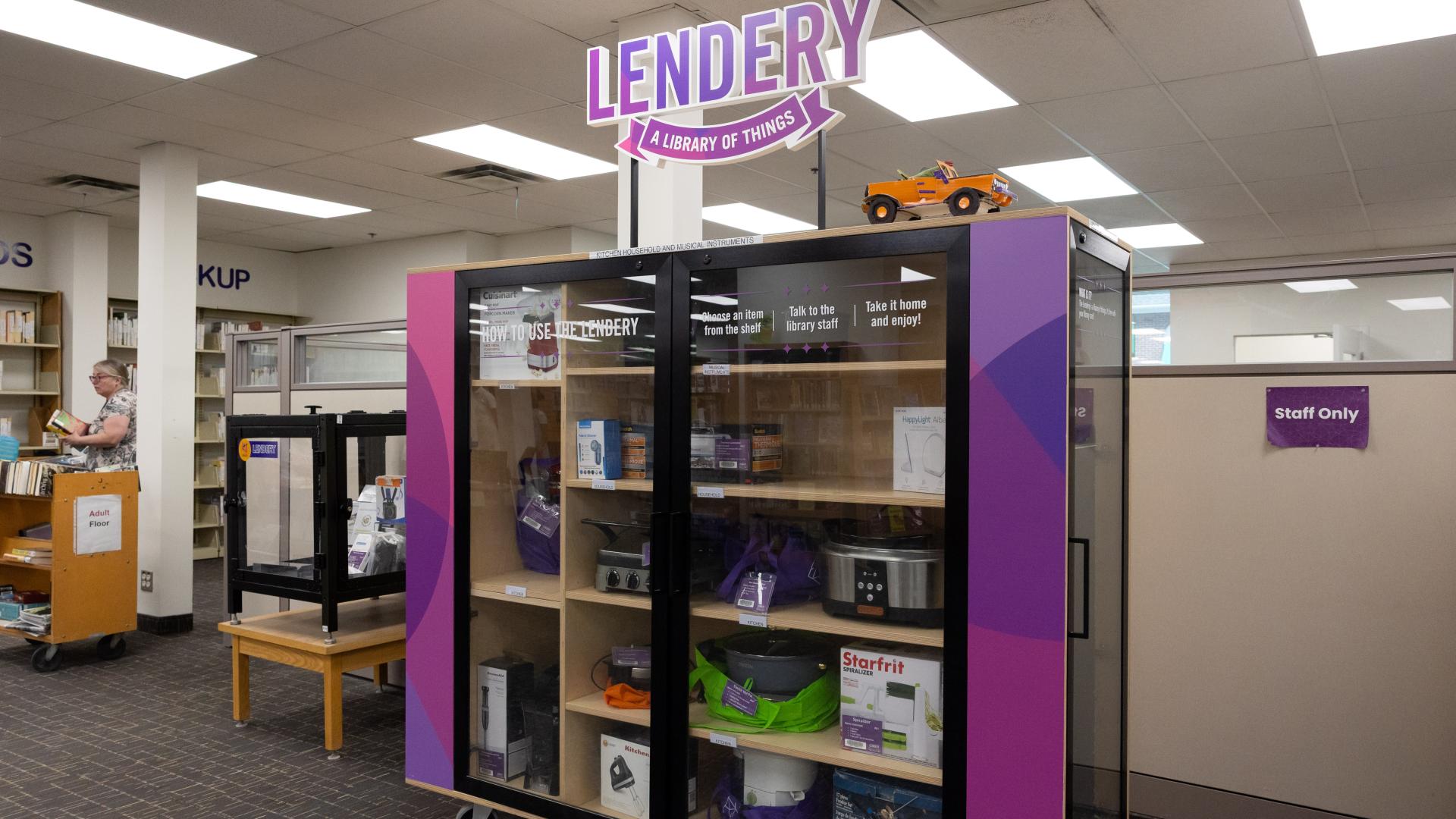 Library section with cabinets holding various gadgets and toys.