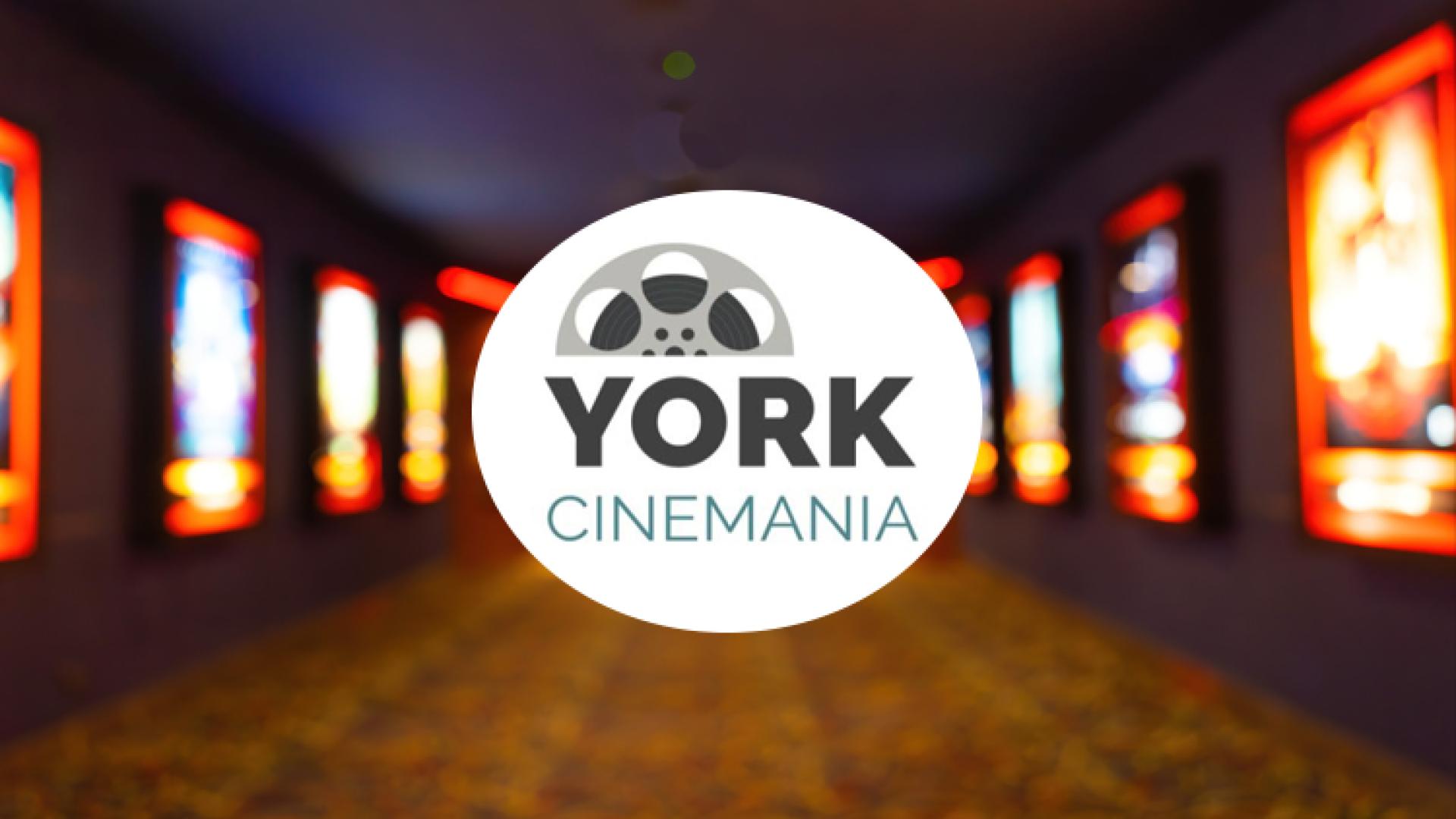 York Cinemania logo over blurred movie posters in hallway.
