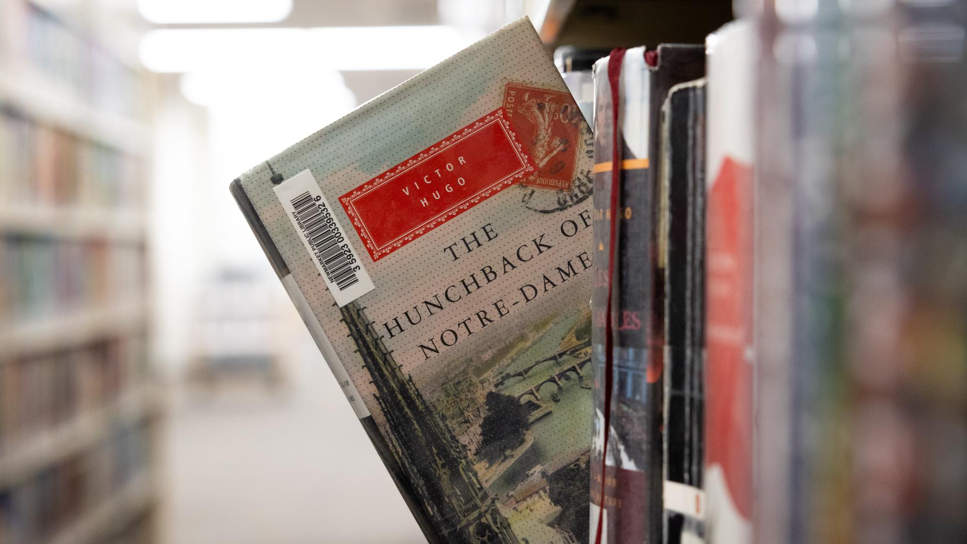 book sticking out of bookshelf