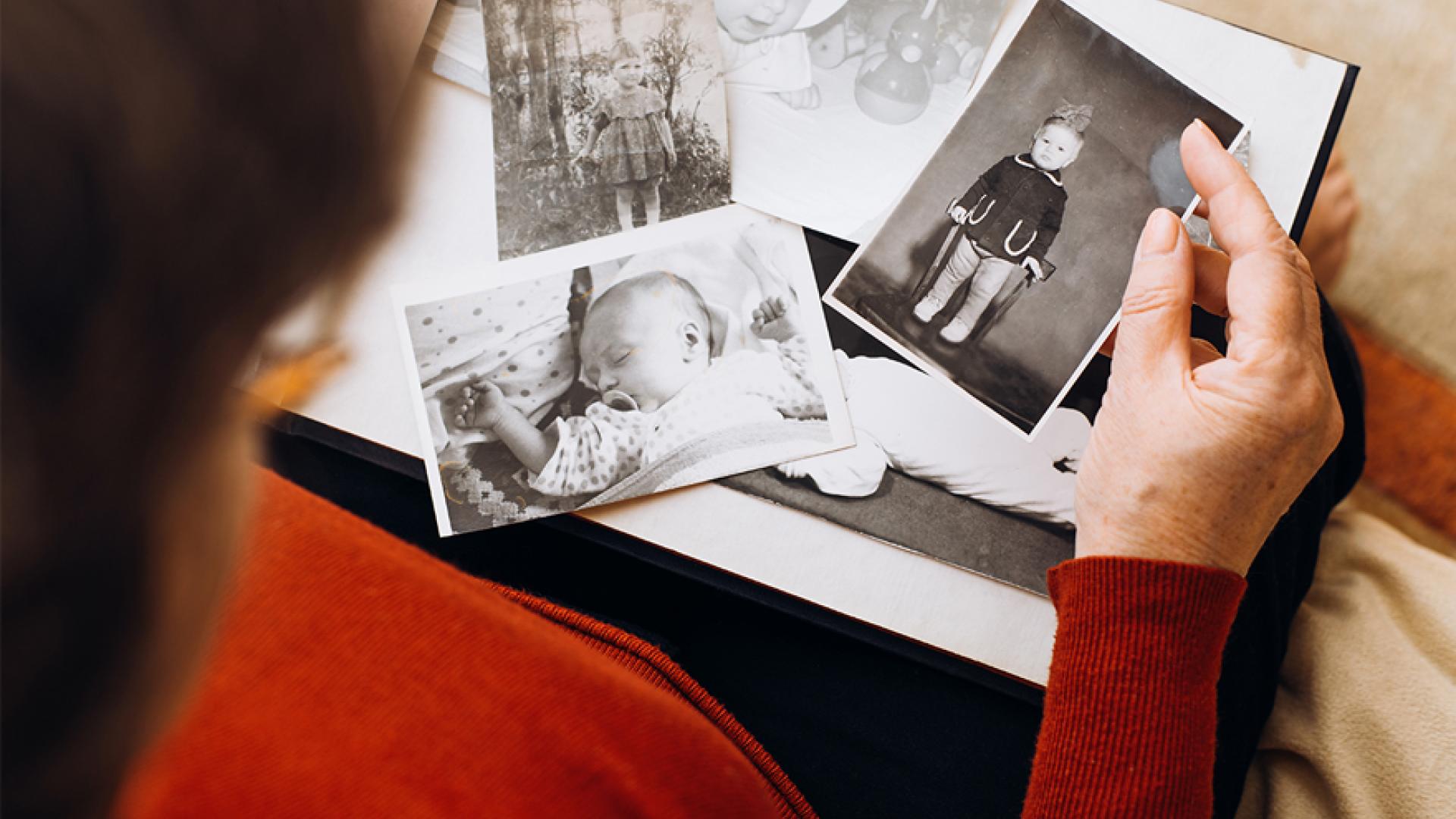 Woman looking through old photos