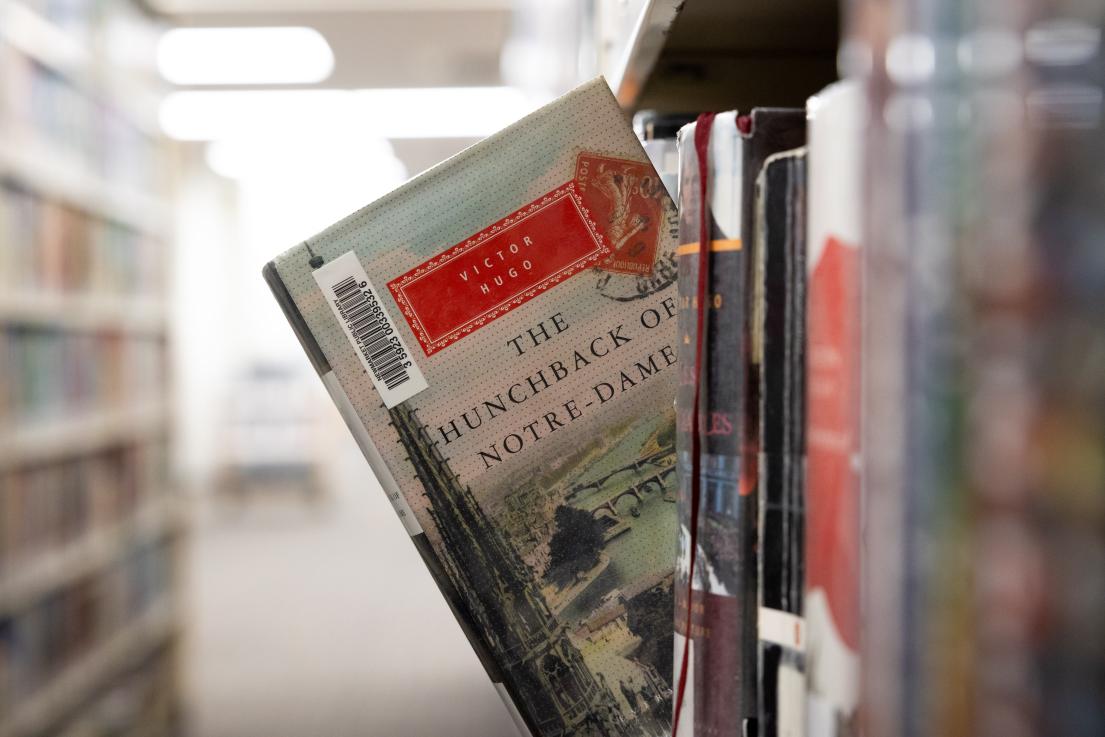 book sticking out of bookshelf